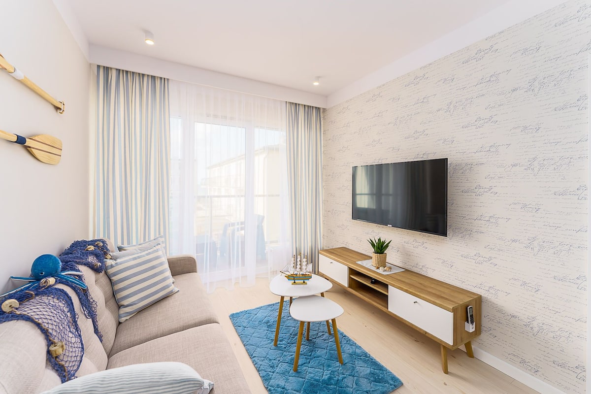 Deluxe-Apartment | Wohnbereich | Flachbildfernseher