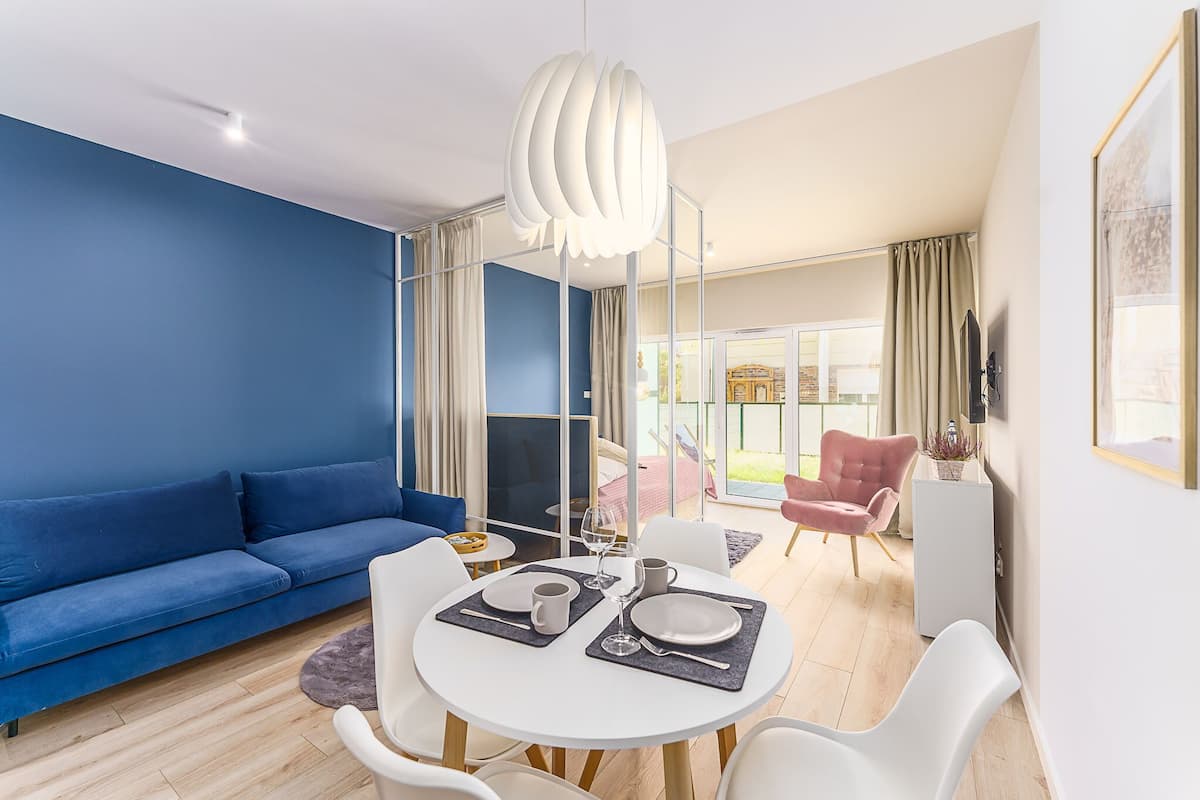 Deluxe Quadruple Room, 1 King Bed with Sofa bed, Non Smoking, Beachside | Living area | Flat-screen TV