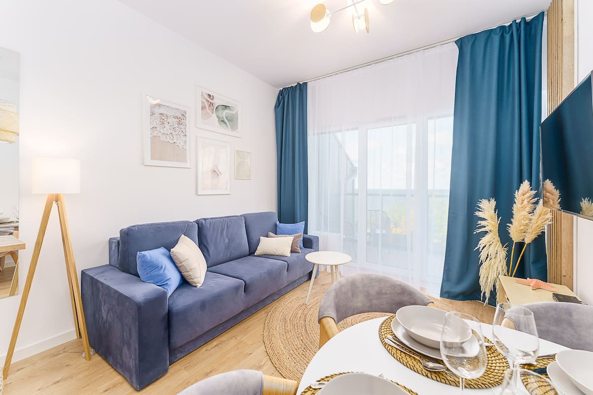 Deluxe-Apartment | Wohnbereich | Flachbildfernseher