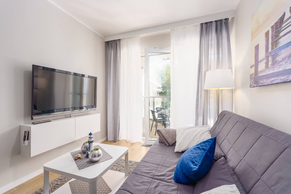 Deluxe-Apartment | Wohnbereich | Flachbildfernseher