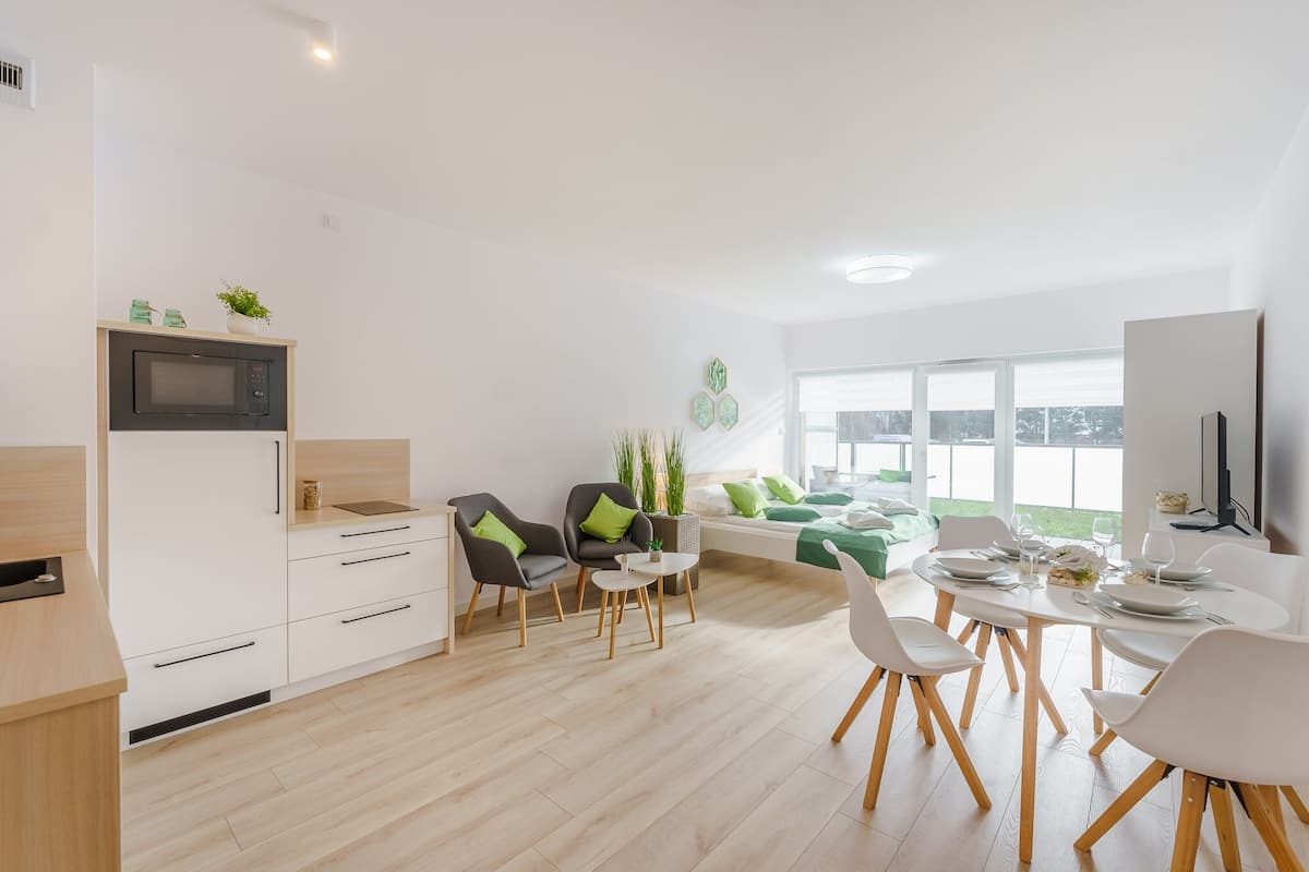 Deluxe-Studiosuite | Wohnbereich | Flachbildfernseher