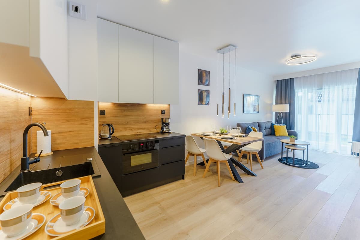 Deluxe-Apartment | Wohnbereich | Flachbildfernseher