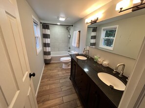 Combined shower/tub, hair dryer, towels, soap