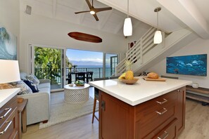 Enjoy cooking in this well-lit kitchen with a large island and sink.