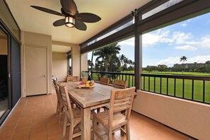 Enjoy meals on the balcony with a view of the golf course and well-manicured lawn.