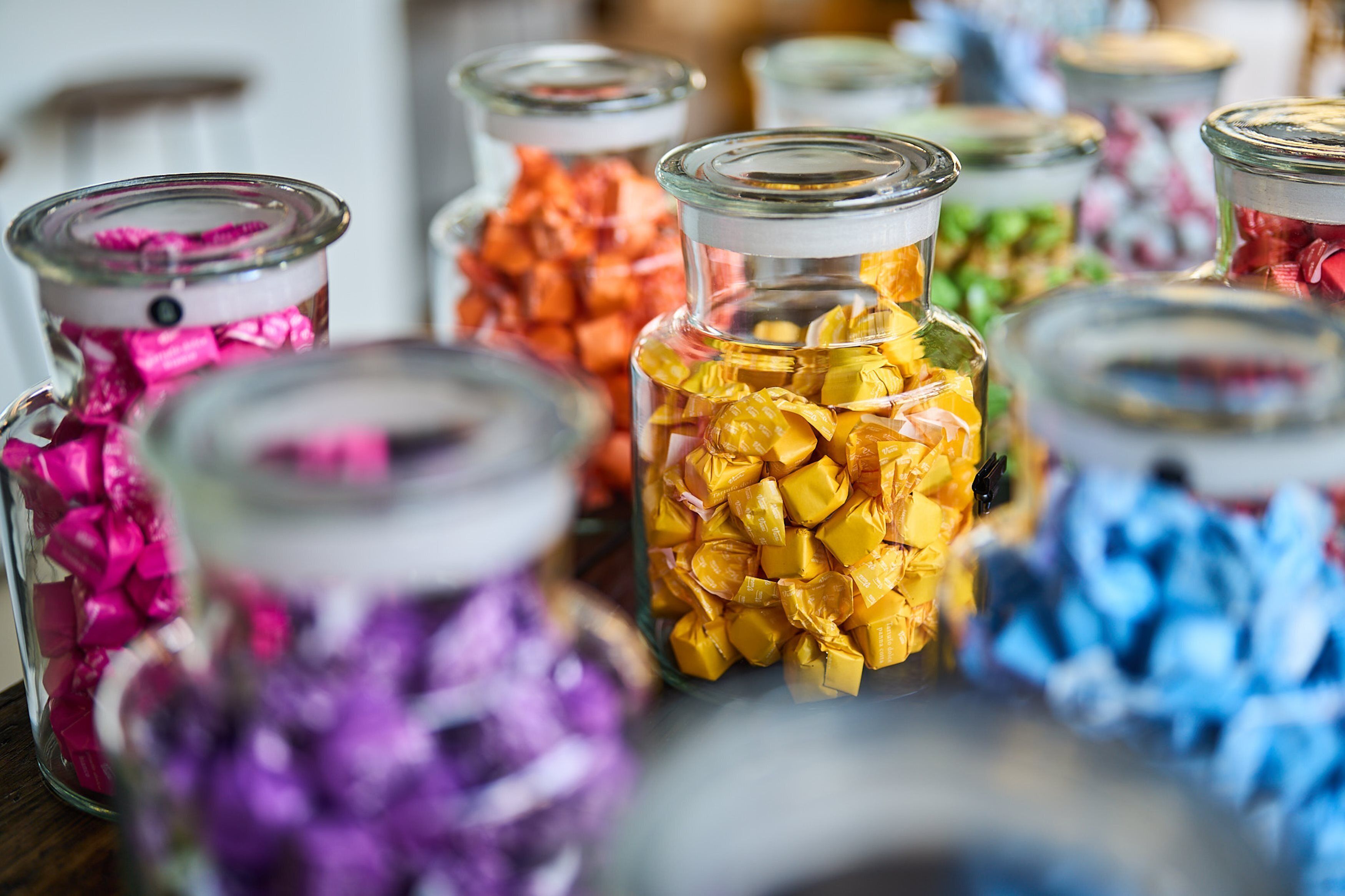 Glass jars filled with colorful candies.