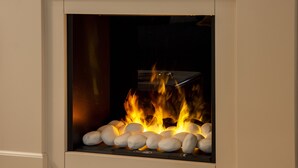 A fireplace with white stones and a visible fire. - Two bedroom apartment with ensuite bathrooms in a perfect location. (Venezia)