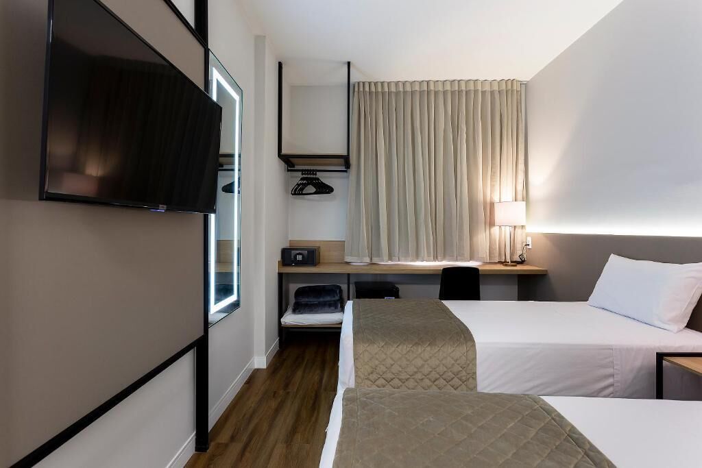 Deluxe Quadruple Room, 2 Bedrooms | Minibar, in-room safe, desk, laptop workspace