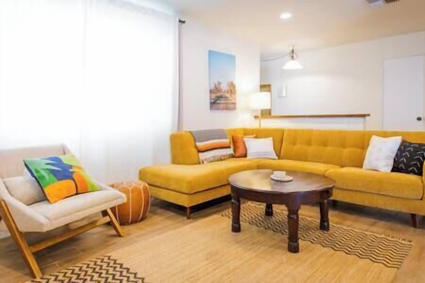 [Living Room]Spacious indoor seating area with TV, record player, and board games. (2)