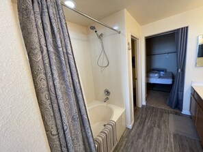 Combined shower/tub, hair dryer, towels, soap