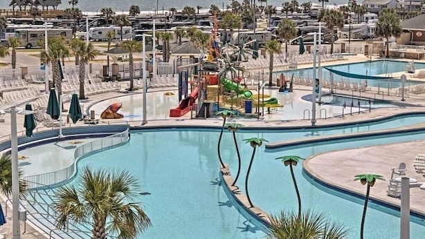 A resort with multiple swimming pools, a water slide, and beachside views. - Welcome to Serinity on the Beach (Myrtle Beach)