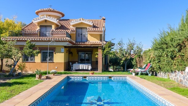 A two-story house with a swimming pool in the backyard. - Casa Rural cerca de Granada Otura by Ruralidays (Granada)