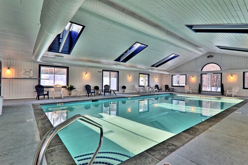Ski-in/out condo near lifts with a fireplace, pool, hot tub, & tennis