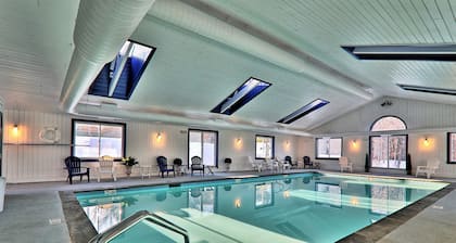 Ski-in/out condo near lifts with a fireplace, pool, hot tub, & tennis