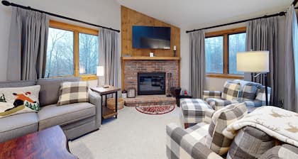 Ski-in/out condo with water & mountain views, private sauna & fireplace