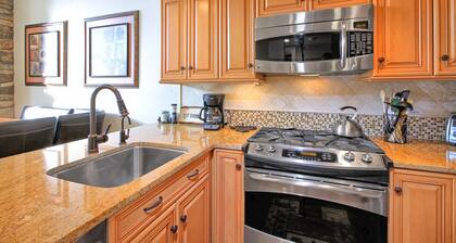 Ski-in/out condo with mountain and lift views, hot tub, & pool