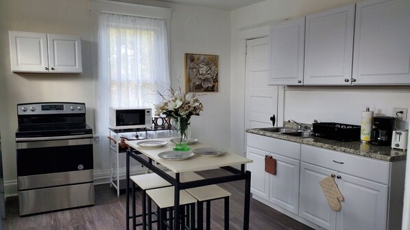 Microwave, coffee/tea maker, cookware/dishes/utensils