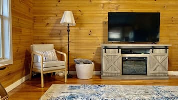 Smart TV, fireplace, DVD player, books