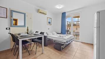 Apartment, 1 Bedroom | Living area | 30-inch flat-screen TV with satellite channels, TV