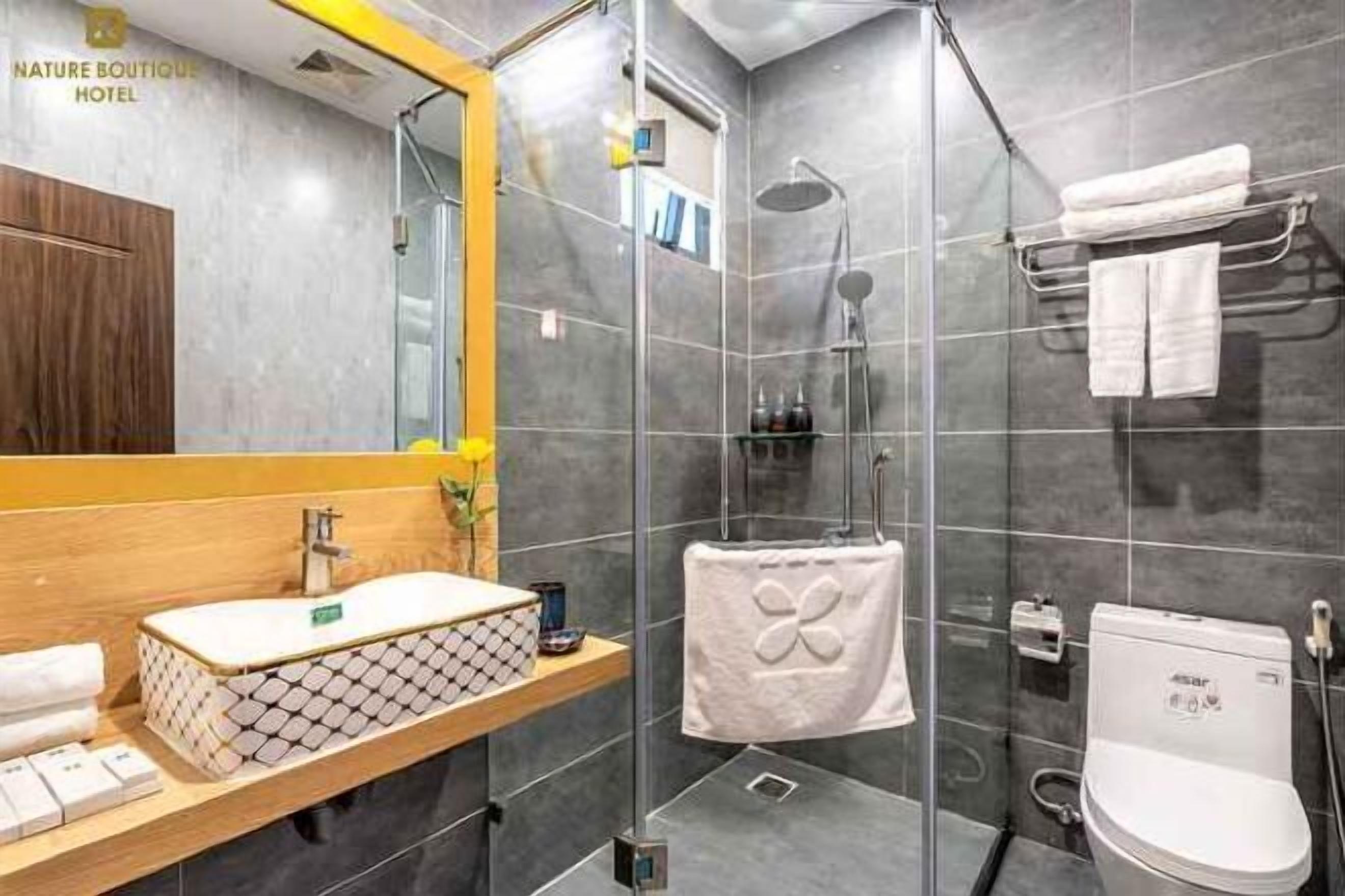 Bathroom | Shower, rainfall showerhead, designer toiletries, hair dryer