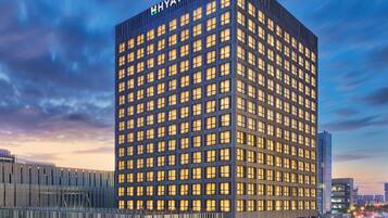 A multi-story building with a grid of windows and the name 'HYATT PLACE' on the top.