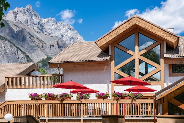 Enjoy a picturesque meal on the balcony with alpine vistas.