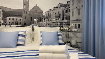 Standard Suite, Balcony, Courtyard View | 1 bedroom, travel crib, free WiFi, bed sheets