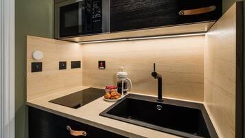 Fridge, stovetop, coffee/tea maker, cookware/dishes/utensils