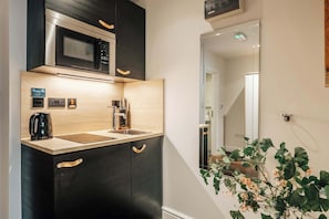 Fridge, microwave, stovetop, coffee/tea maker