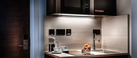 Fridge, microwave, stovetop, coffee/tea maker