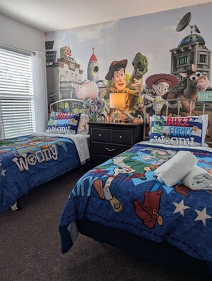 A bedroom with two beds, a dresser, and a mural on the wall. - 558- Stunning 5BR 4.5BA Veranda Palms Villa w/ South-Facing Pool, Spa & No Rear Neighbors (Kissimmee)