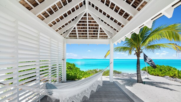 A hammock under a white gazebo with a view of a beach and ocean. - Ba Roos Beach House/Iconic Tar Bay Estate with 300’ of Direct Beachfront (Mosstown)