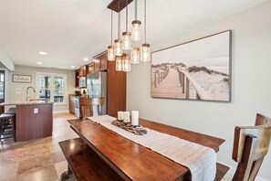 Enjoy meals in this kitchen with a central island, oven, and dining area.
