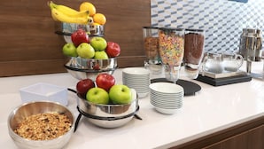 A breakfast buffet with fruits, cereals, and milk. - Holiday Inn Express Monterrey Fundidora by IHG (Monterrey)