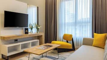 Junior Suite, 1 King Bed, Non Smoking, Balcony | Living area | 42-inch Smart TV with digital channels, TV