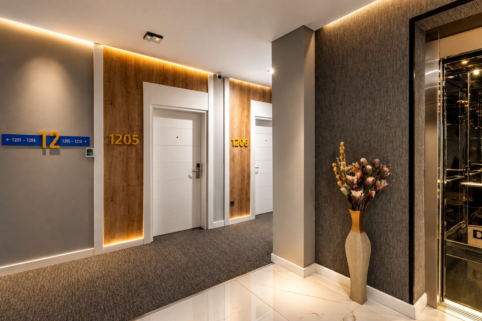 A hotel hallway with numbered doors, a carpeted floor, and a vase with flowers.