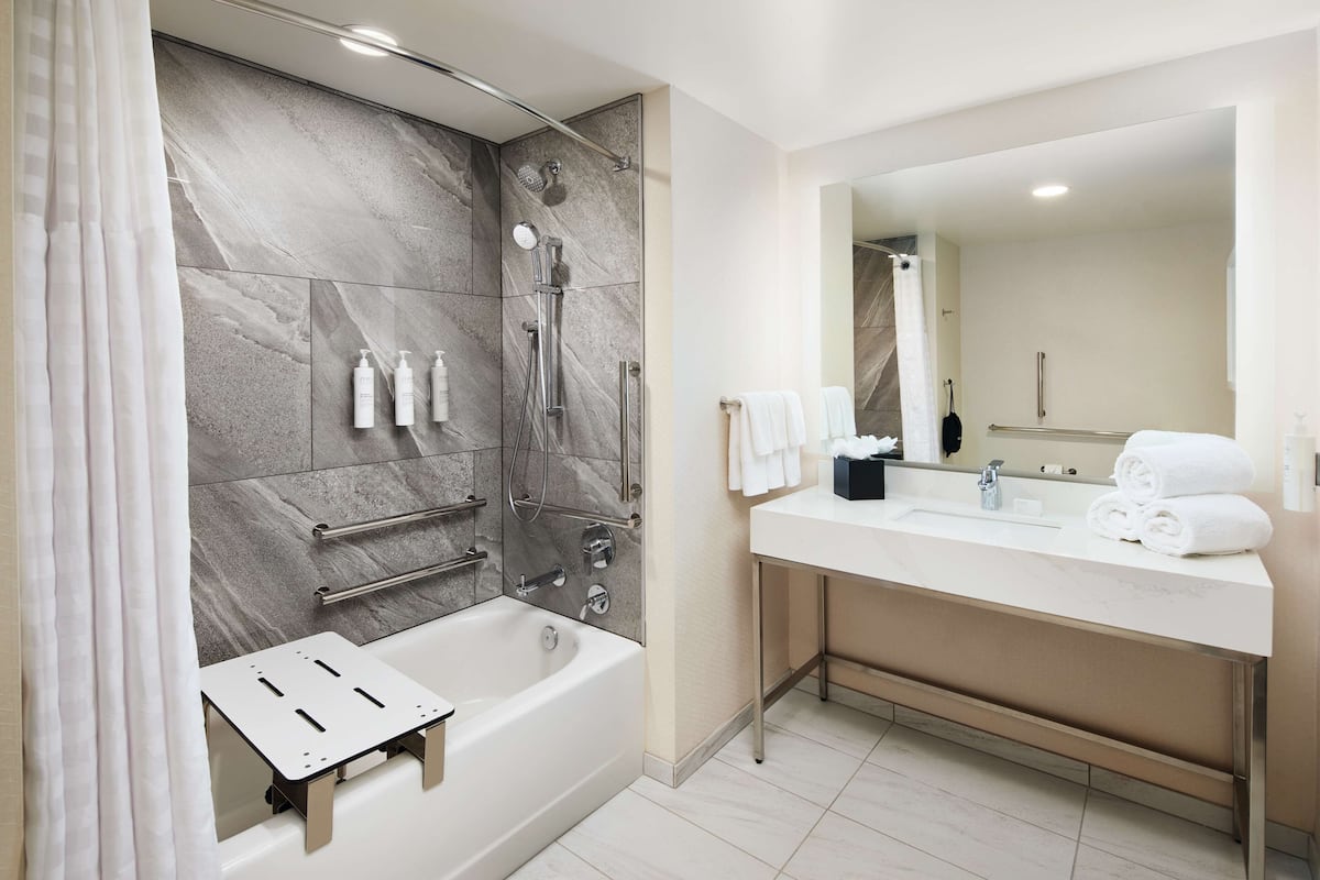suite, 2 queen beds, accessible, bathtub (mobility & hearing) | bathroom | hair dryer, bathrobes, towels, soap