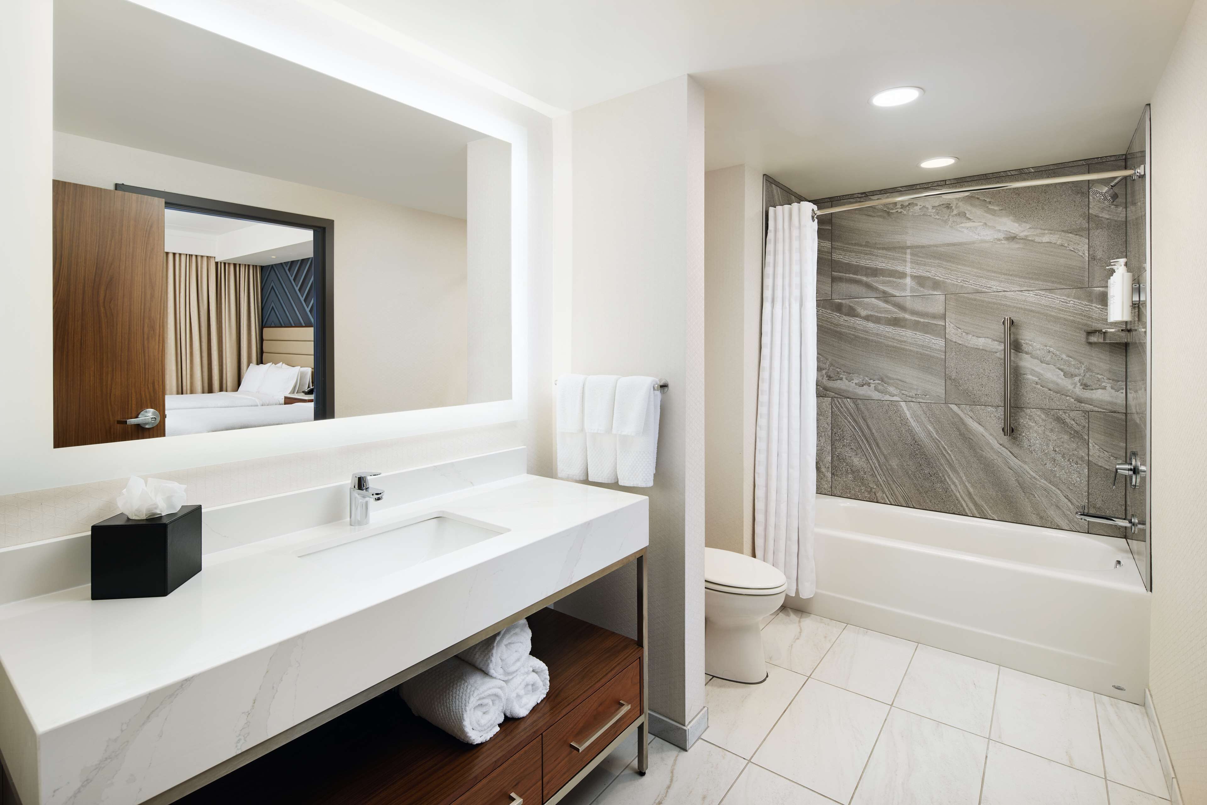 suite, 2 queen beds | bathroom | hair dryer, bathrobes, towels, soap