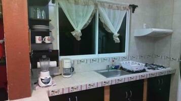 Fridge, microwave, stovetop, coffee/tea maker