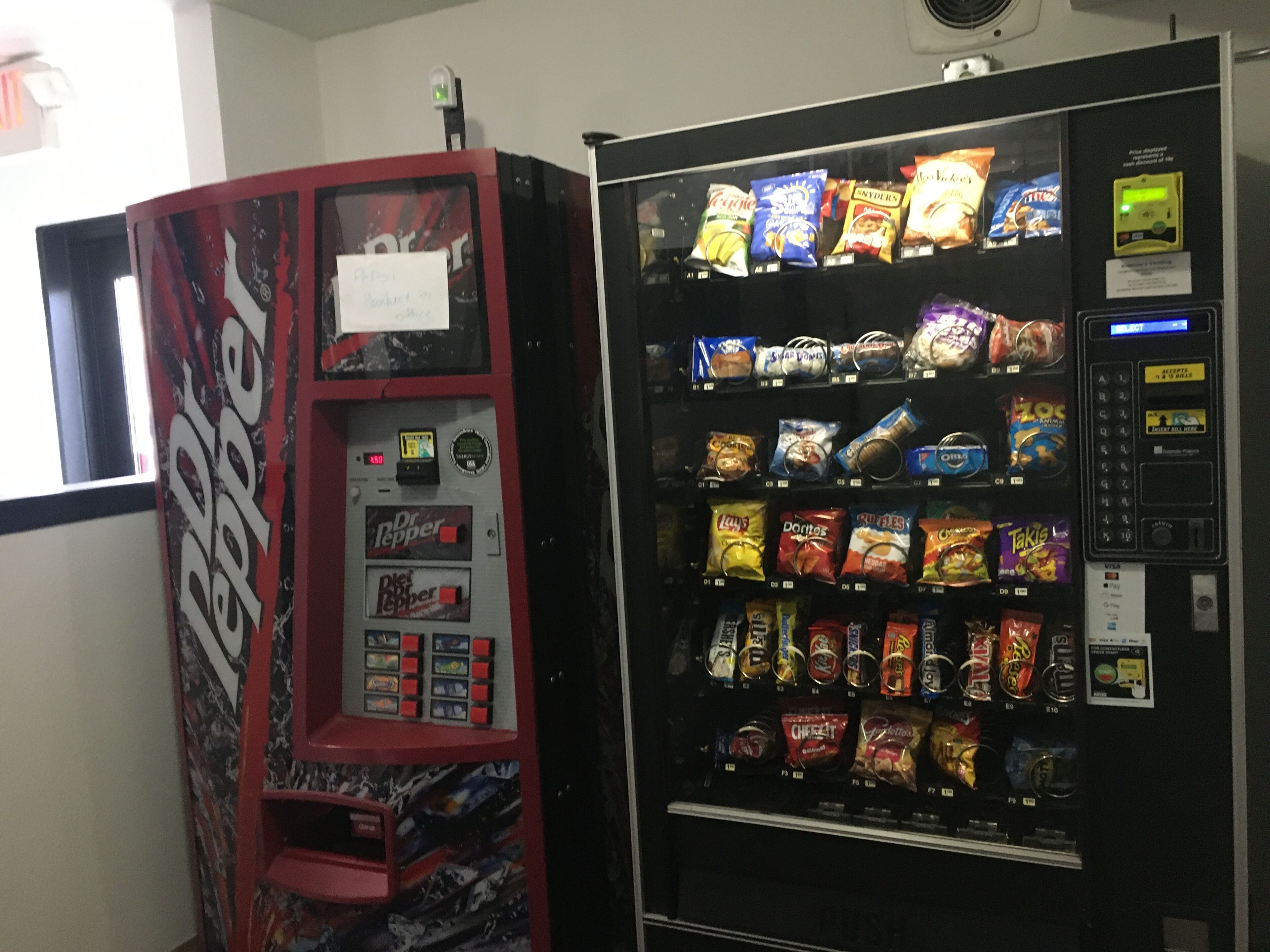 A vending machine with a variety of snacks and a separate section for Dr Pepper.