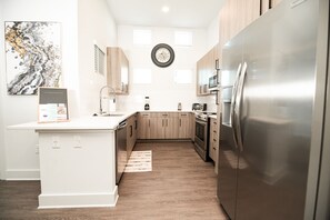 Microwave, dishwasher, coffee/tea maker, cookware/dishes/utensils