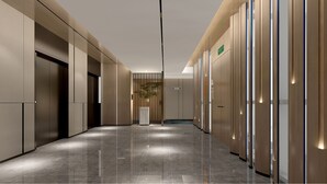 A modern hallway with a polished floor, wooden paneling on the walls, and a plant in the center. - Holiday Inn Express Beijing Yizhuang Center by IHG (Beijing)