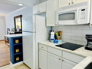 Fridge, microwave, stovetop, coffee/tea maker