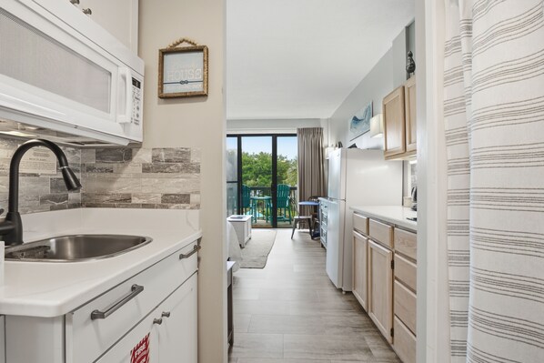 Fridge, microwave, coffee/tea maker, toaster