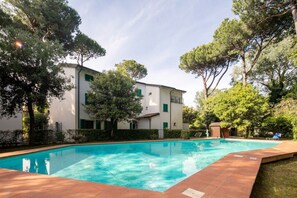 A heated pool, sun loungers