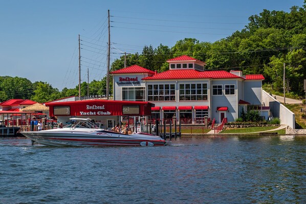 A waterfront property with a Redhead Yacht Club and a Redhead restaurant.