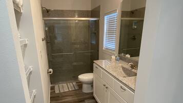 Combined shower/tub, hair dryer, towels, soap
