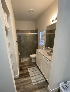 Combined shower/tub, hair dryer, towels, soap