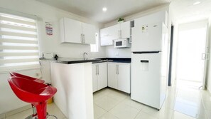 Fridge, microwave, stovetop, coffee/tea maker