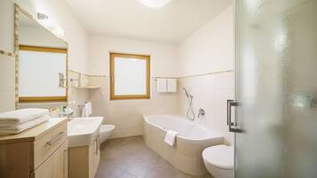 Bathtub, hair dryer, towels